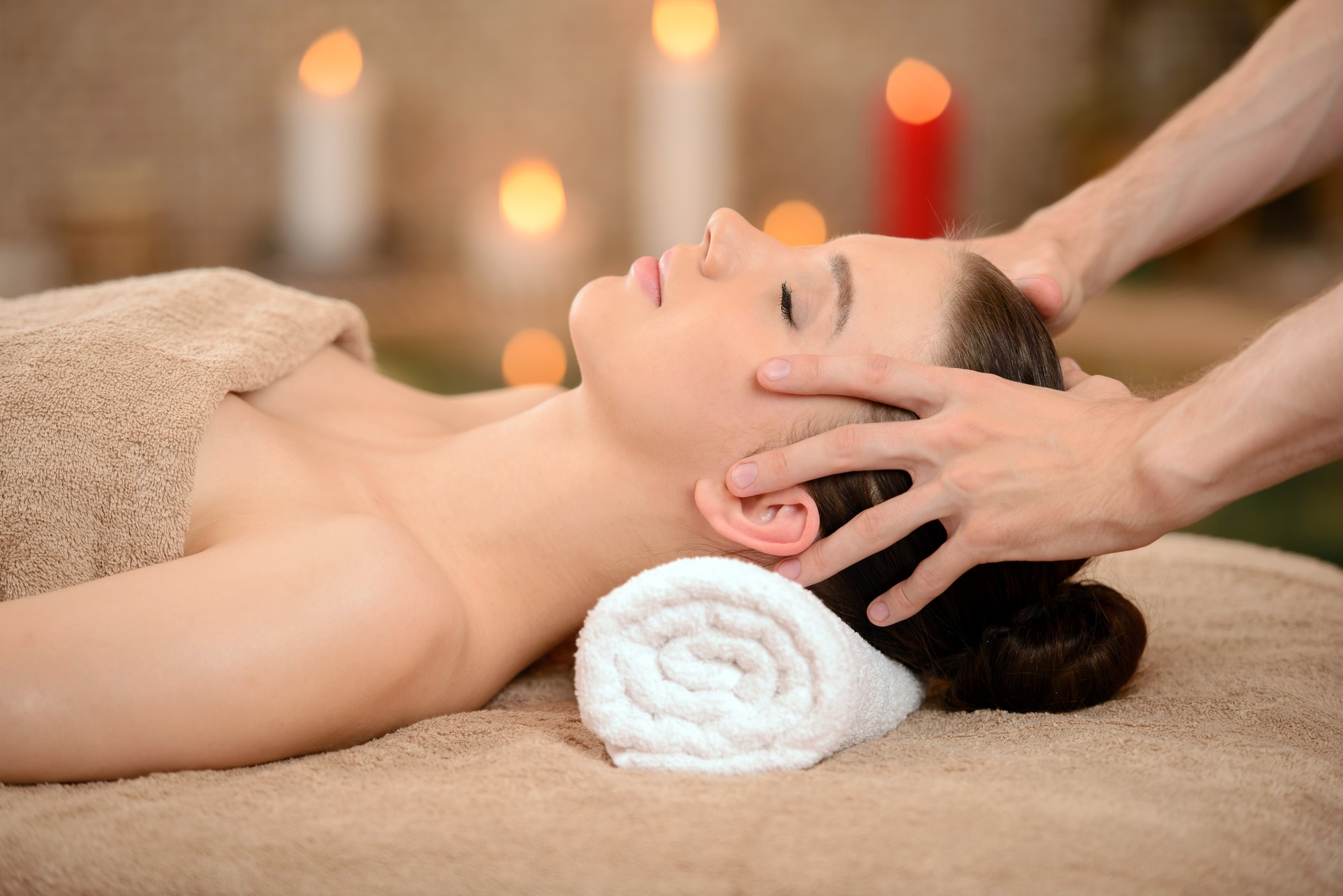 Portrait of Fresh and Beautiful brunette woman taking head massage